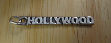 says Hollywood on Travel Sterling Silver Charm