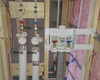 Example of Hot and Cold meters being installed in an apartment building