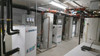 48 unit apartment building installation in Wolfville, Nova Scotia featuring three 20 ton DX2W-3 modules connected to six 10 ton outdoor heat pumps outside.