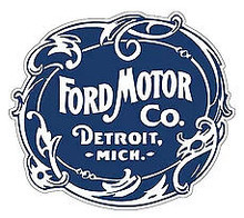 OLD TIME FORD LOGO DIE-CUT EMBOSSED METAL SIGN 17" X 14 5/8" WITH A SAW-TOOTHED HANGER ON THE BACK FOR EASY MOUNTING