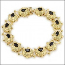 Gemstone Description
Gemstone: Sapphire
Gem Grade: AAA
Cut: Oval Cut
Height: 3 mm
Width: 4 mm
Depth: 6 mm
CTW: 7.15 CTW
Color: Black
Material Information
Primary Material: Sterling Silver
Plating Material: Yellow Gold
Plating Material Karat: 18 k
Primary Material Weight: 22.5 g
Jewelry Information
Mount Type: Bracelet
Gender: Womens
Length: 8.2 in