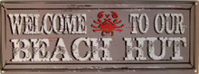 Photo of BEACH HUT & CRAB ENAMEL SIGN WITH A WORN LOOK THAT MAKES IT LOOK MUCH OLDER THAN IT REALLY IS
