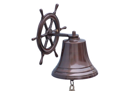 Elegantly designed and gleaming with a lustrous shine, this fabulous Antique Copper Hanging Ship Wheel Bell 10" is equally stunning indoors or out. In addition to being fully functional, this shipS wheel bell is a great addition to any existing nautical theme in your home. Make metal nautical wall art shine through and enjoy this wonderfully decorative style and distinct, warm "strike through" nautical tone with each and every resounding ring.

Note: Each ships bell's length is measured from the highest point of its hanger to the lower lip of the bell, while the width is the diameter of the flared bell opening.

Dimensions: 7" Long  x 9" Wide x 10" High

NOTE: Wall mounting hardware not included.
?Handcrafted from copper by our master artisans

?Fully functional marine bell with a deep rich strike through tone

?Solid, sturdy and heavy
?Wonderful ships wheel decoration
?Perfect nautical home decor

?Polished to a lustrous shine