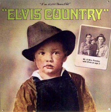 A REPRODUCTION OF THE ALBUM COVER "ELVIS COUNTRY", 
SHOWING A PICTURE OF ELVES AT 2 YEARS AND HIS PARENTS
PICTURE IN THE BACKGROUND, GREAT COLOR AND DETAILS