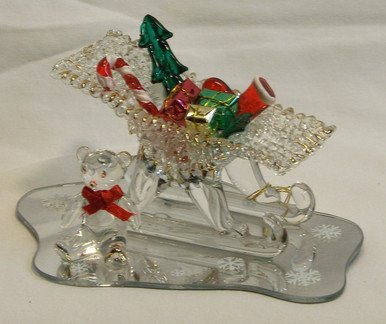 GLASS SLEIGH WITH GIFT & BEAR ON MIRROR 22K GOLD TRIM
 5" X 3 1/4" X 2 5/8" HAND CRAFTED & HAND PAINTED