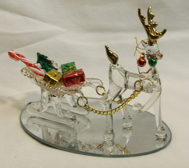 GLASS REINDEER PULLING SLEIGH W/GIFTS ON MIRROR 
22K GOLD TRIM 4 3/4" X 3 1/4" X4" 
HAND CRAFTED & HAND PAINTED