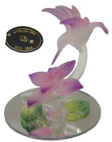 GLASS PINK HUMMING BIRD OVER FLOWER ON MIRROR 
2 1/2" X 2 1/2" X 3" HAND CRAFTED & HAND PAINTED