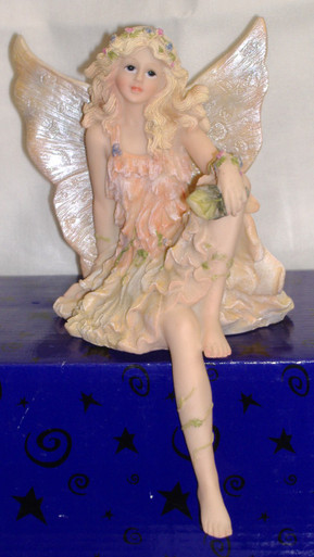 PORCELAIN FAIRY SITTING ON SHELF IN PINK 4 1/2" X 5 1/2" X 7" HAND CRAFTED & HAND PAINTED