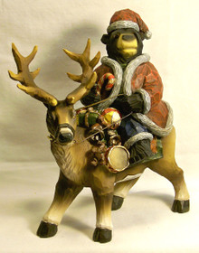 SANTA BEAR RIDING REINDEER WITH GIFTS 
MEASURES 8 1/4" X 4 1/8" X 9 3/4" RESIN, ONLY 5 LEFT