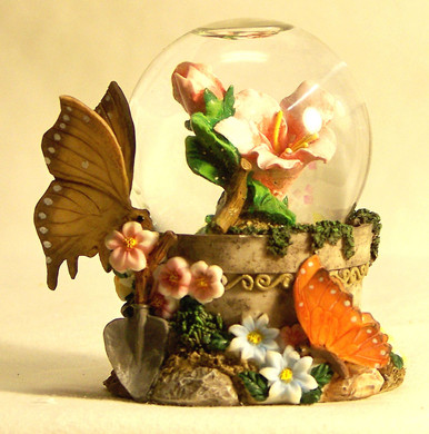 MINITURE SNOW GLOBE WITH BUTTERFLYS & FLOWER
 MEASURES 2 1/2" X 2" X 3 1/8"