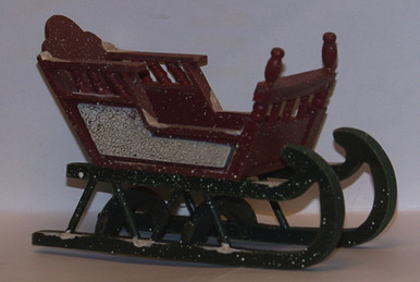 SMALL ORNATE WOODEN BABY SLEIGH  
MEASURES 5 3/8" X 2 7/8" X 3 3/8"