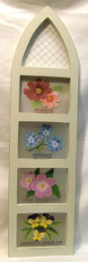 FOUR FLOWERS IN CHURCH WINDOW SHAPED WOOD FRAME MEASURES 6 1/2" X 3/8" X 23 1/2"