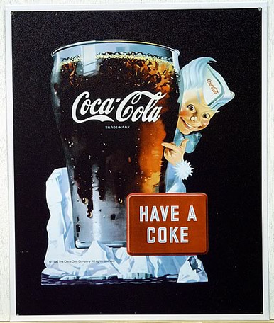 Photo of COKE SPIRITE BOY #1 WHITE SIGN, A COCA-ADD ICON FROM THE 1950'S HAS GREAT DETAIL AND RICH COCA-COLA COLORS