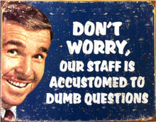 Photo of DUMB QUESTIONS, DON'T WORRY, OUR STAFF IS ACCUSTOMED TO DUMB QUESTIONS SIGN. FADED COLORS AND GRAPHICS MAKE THIS SIGN LOOK LIKE IT CAME FROM THE 60'S