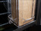Vertical Dispenser attached to cage bars with a chipboard box inside