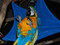 Macaw lying in a large Square Hammock.
