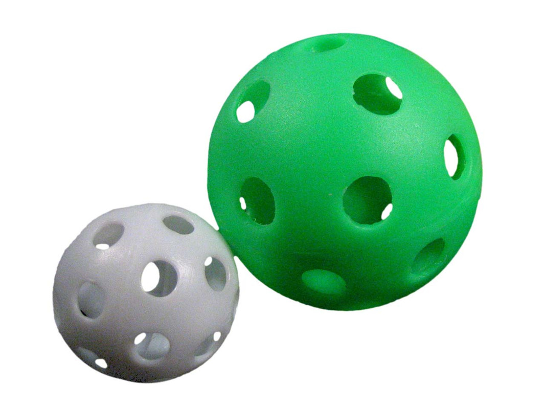 The two sizes of Wiffle Balls shown together