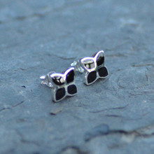 Sterling silver stud earrings set with four natural black shiny stones