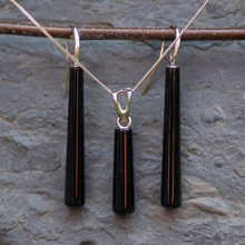 Matching gift set of long cylindrical Whitby Jet drop pendant and earrings on 9ct gold