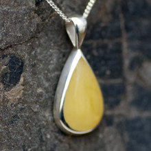 Modern butterscotch Baltic amber and sterling silver teardrop pendant