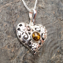 Curved 925 silver filigree love heart necklace with round cognac amber cabochon