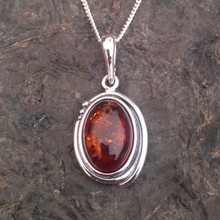 Classic sterling silver oval pendant with cognac amber cabochon