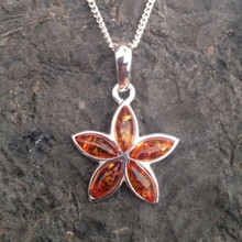 Contemporary sterling silver star pendant with five cognac amber marquise stones
