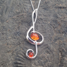 Sterling silver treble clef pendant with cognac amber stones