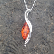 Elegant Sterling silver and Baltic cognac amber wave pendant