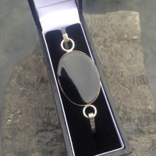 Sterling silver slim bangle with large oval Whitby Jet stone