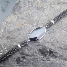 Gents black plaited leather bracelet with large oval Whitby Jet black stone 