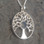 Circular 925 silver tree of life necklace with hand carved natural black stone