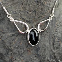 Contemporary sterling silver necklace with oval Whitby Jet cabochon and adjustable snake chain