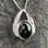 Fancy sterling silver Whitby Jet cubic zirconia asymmetrical pendant with oval stone