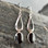Long modern sterling silver drop earrings with oval Whitby Jet stones