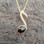 Hand crafted Whitby Jet 9ct gold music pendant with gold curb chain