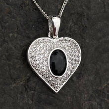 Sparkly sterling silver heart pendant with oval organic shiny black gemstone