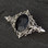 Fancy silver brooch with large oval natural black gemstone