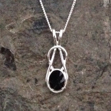 Contemporary sterling silver Celtic loop pendant with oval Whitby Jet stone
