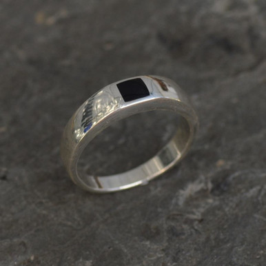 Contemporary sterling silver ring set with flush set square Whitby Jet stone