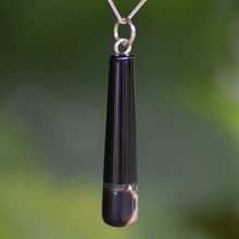 Long Cylindrical Whitby Jet and Amber drop pendant on a 9ct gold curb chain