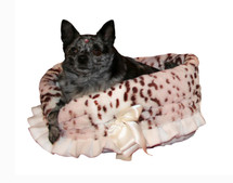 3-In-1 Reversible Snow Leopard Snuggle Bug functions as a pet bed, a car seat or a shoulder tote.

