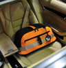 Sleepypod Air Orange Airline Approved Pet Carrier being used as a car pet safety seat