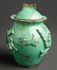 Treat jar is adorned with raised motif dogs, rawhide bones, chew bones, toys, etc.