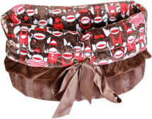 3-In-1 Reversible Funky Monkey Snuggle Bug functions as a pet bed, a car seat or a shoulder tote.
