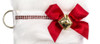 Shih Tzu Christmas Holiday Dog Stocking has a white satin ribbon "collar”  with red rhinestone accents, a red satin bow & hanging loop, a gold-tone jingle bell & d-ring, from which hangs a paper ID for personalization (not shown).