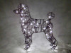 Lighted Standard Poodle Topiary Form not available but the look can be achieved by attaching black wired LED lights (not included) with black electrical cinch ties to a frame form