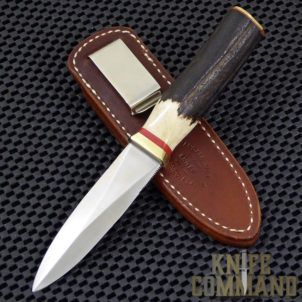 Randall Made Knives Model 24 Guardian Stag Brass Boot Knife.  All red spacers.
