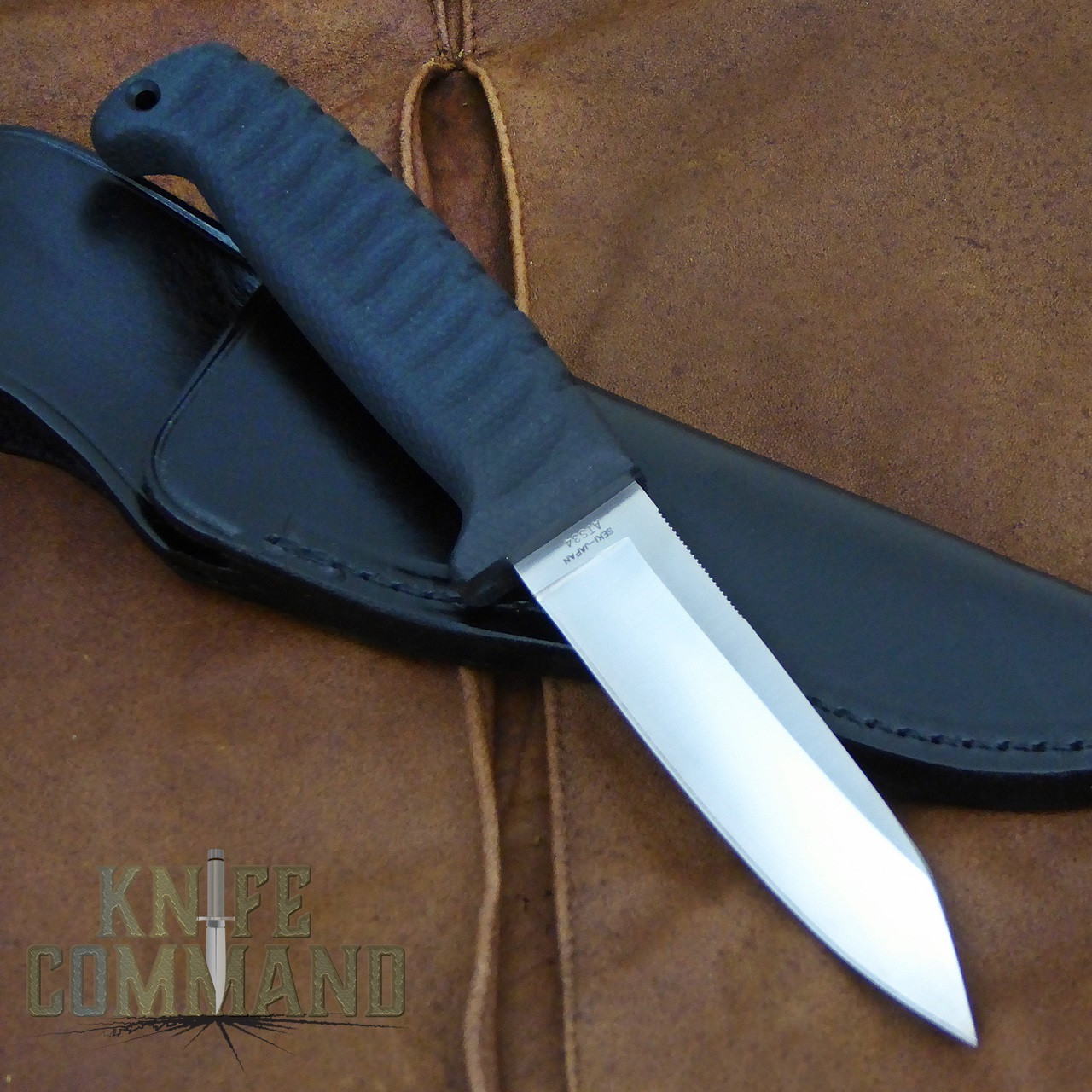 G Sakai Wicky Chinu Large Hunting and Fishing Knife 10331.  Nice black leather belt sheath.