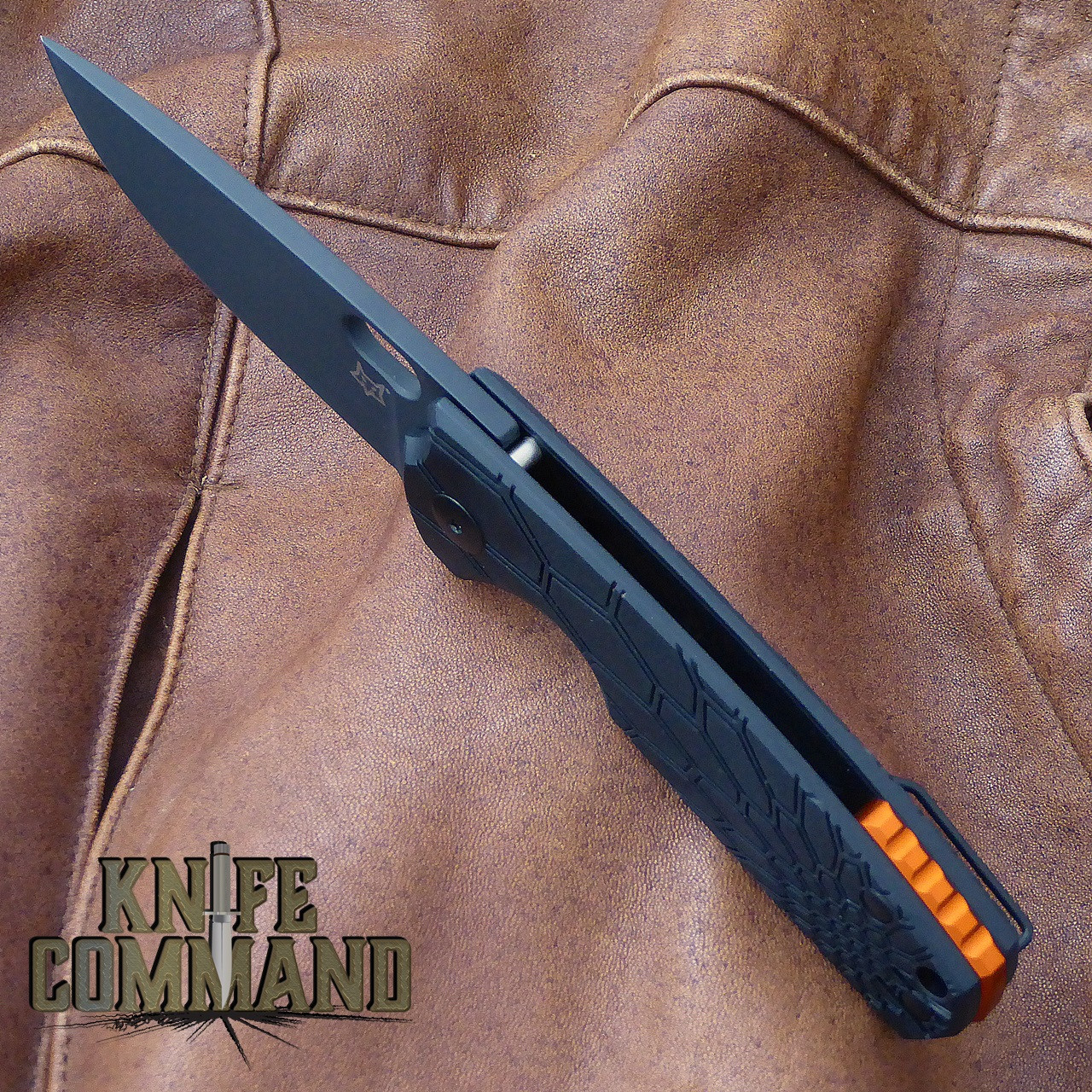 Fox Knives Vox Core FX-604B Folding Knife Black Handle Black Blade.  Orange anodized aluminum back spacer.